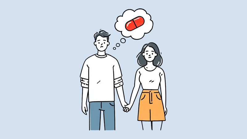 A young couple holding hands, he's thinking about red pills.